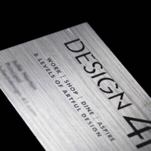 Plastic business card with brushed metal finish